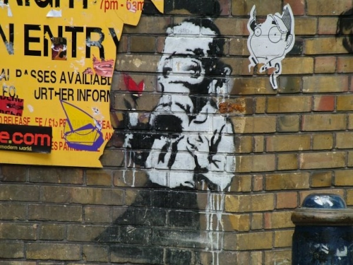 Unmasking the Establishment: Banksy's Activist Statement
